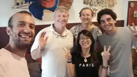 Travellers smiling together during a stay at Sojourn Beds & Cafe in Taiping