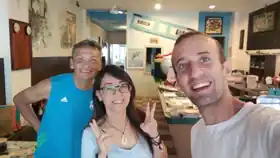Two travellers enjoying a relaxed moment at Sojourn Beds & Cafe in Taiping