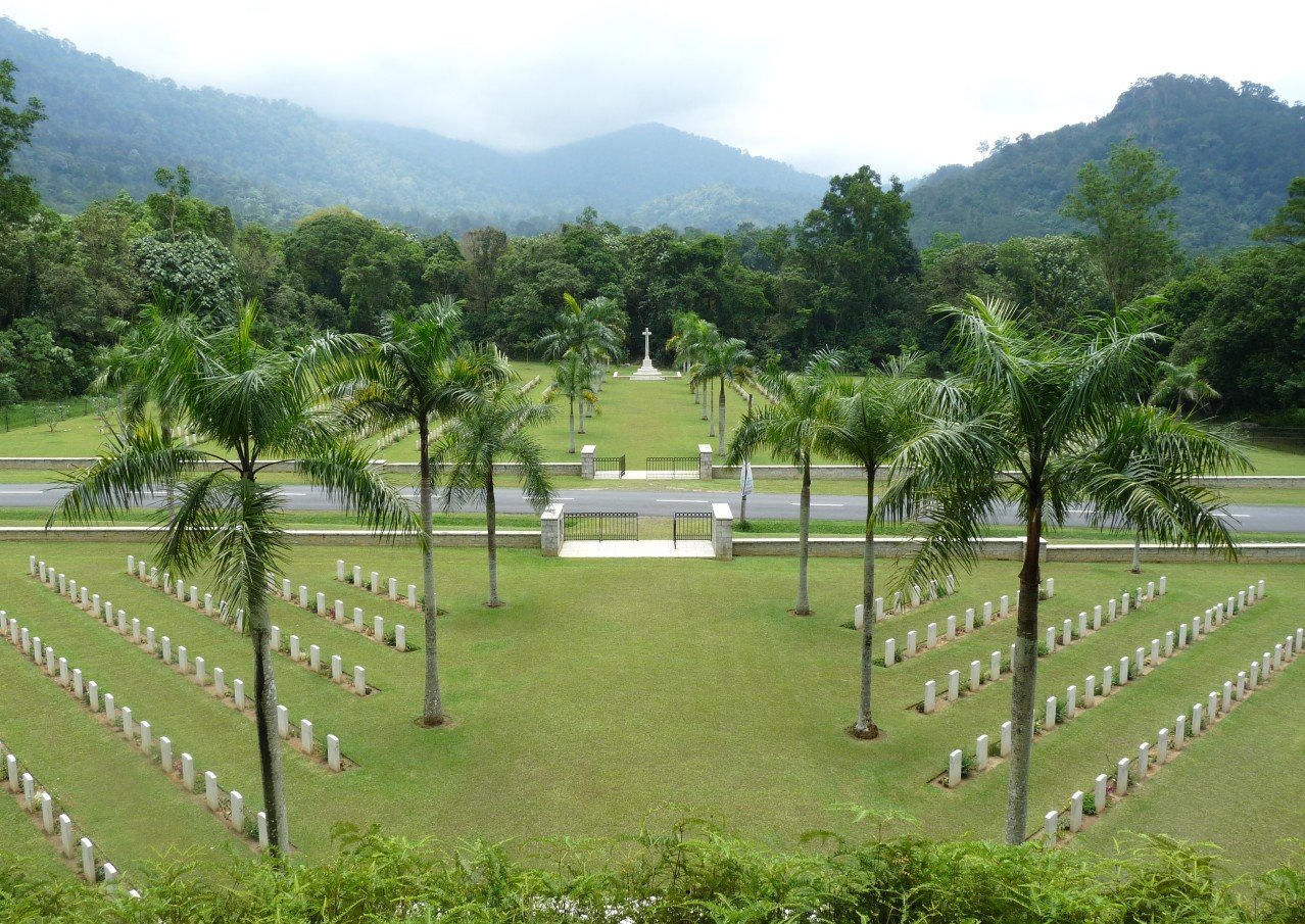 Taiping War Cemetery with palm-lined Commonwealth headstones and memorial Cross, photographed by Bubbha in 2009